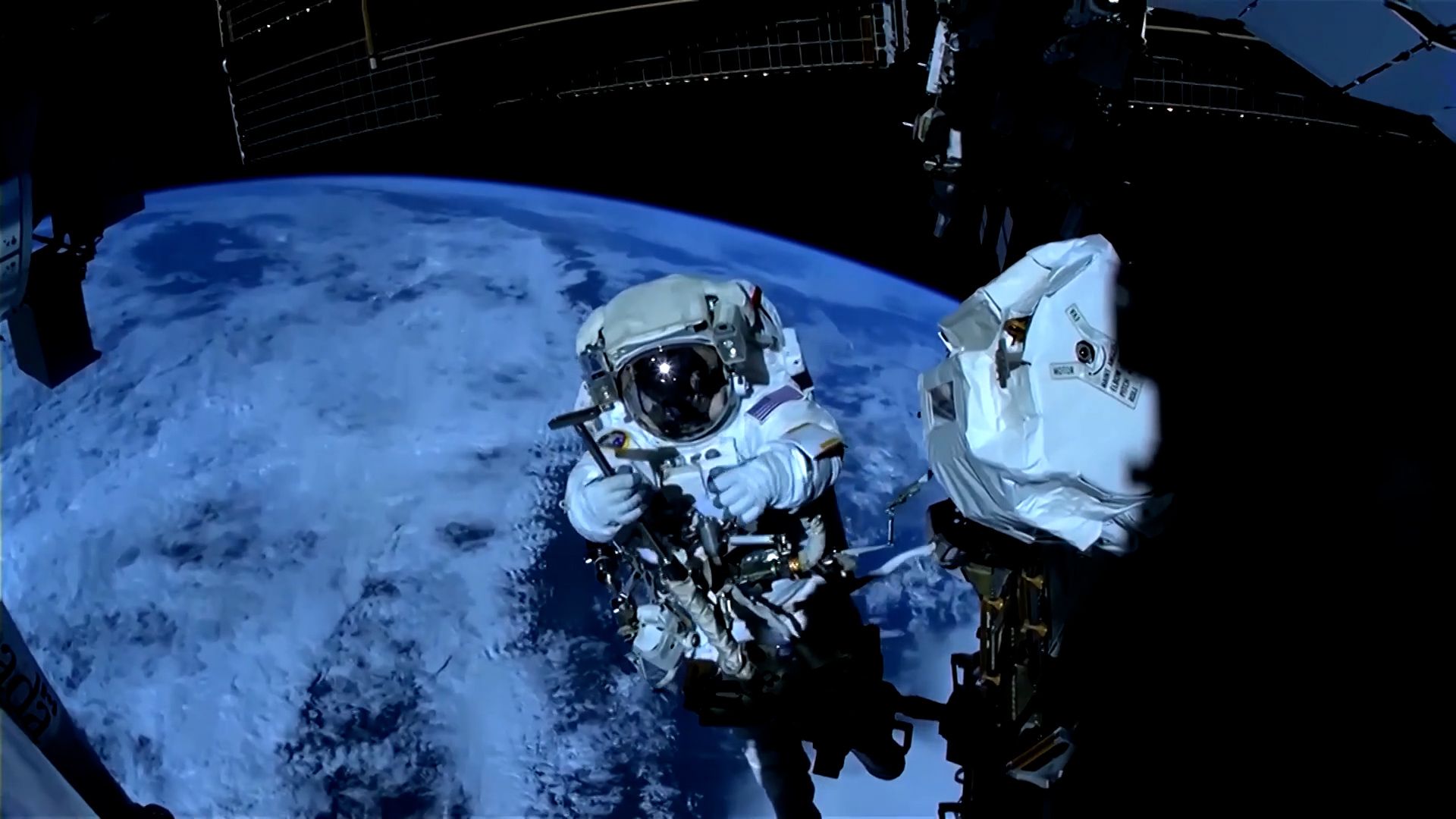 NASA Astronauts Conduct Spacewalk to Repair Robotic Arm